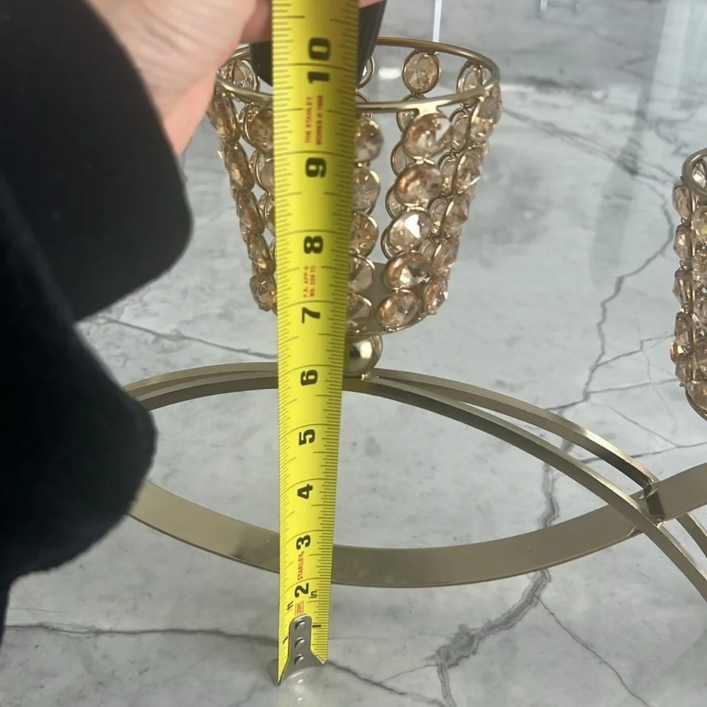 Elegant gold metal like candle holder with beautiful shiny crystal like gems